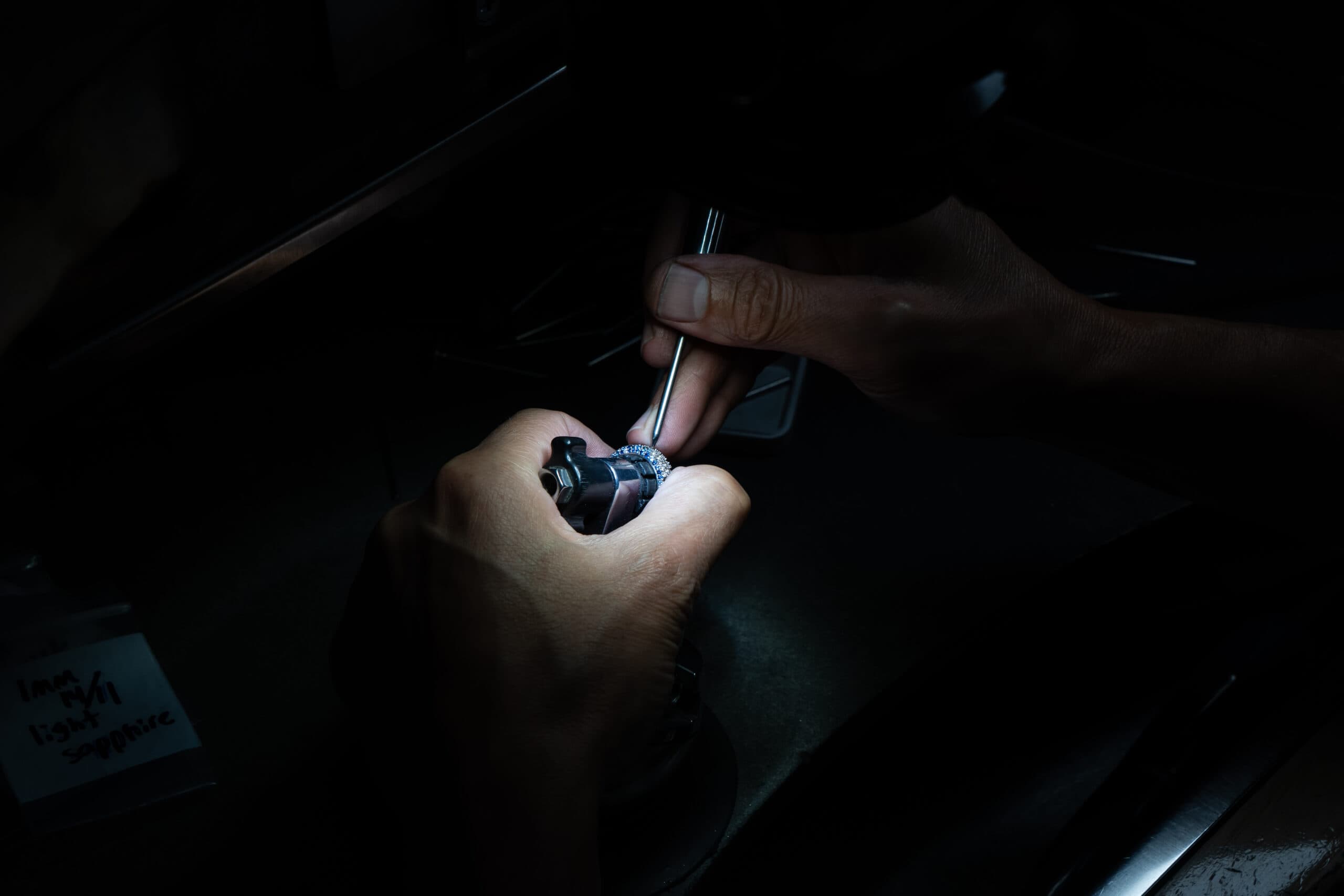 Alex Petrov examining jewelry at the workbench