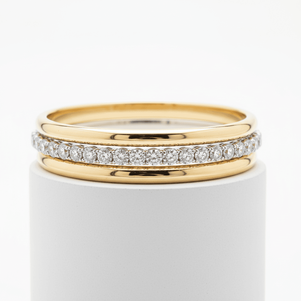 Stacked yellow gold wedding bands with a diamond eternity band centered between them